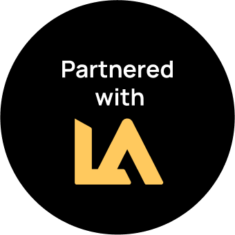 Black background with "Partnered with" text in white above a gold, stylized "LA" logo, giving it a touch of home elegance.